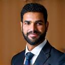 Professional headshot of Ahmed Al-Farsi.