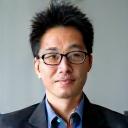 Professional headshot of Hiroshi Tanaka.